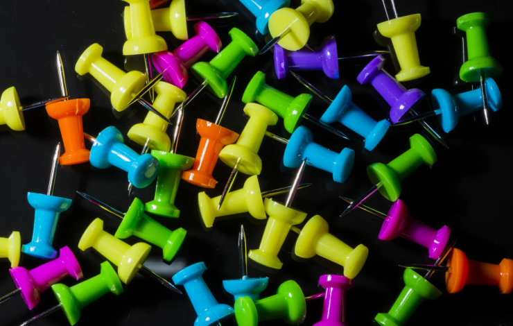 group of pins in black background