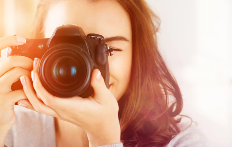 woman taking a picture with a nice camera
