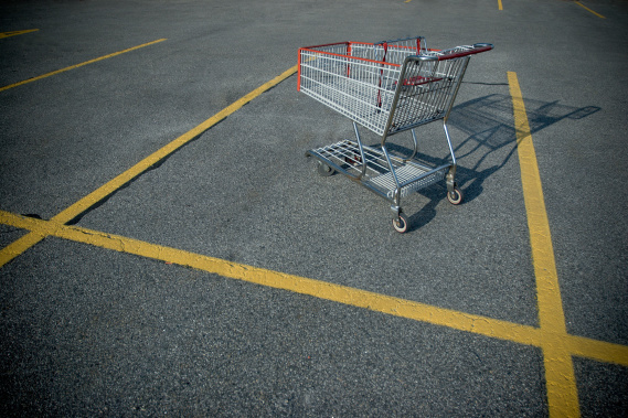 shopping cart abandoned in a parking lot