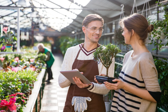 woman buying plants at a nursurey