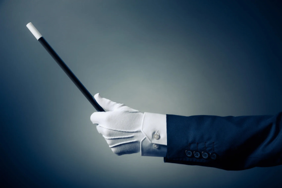 magician holding a wand