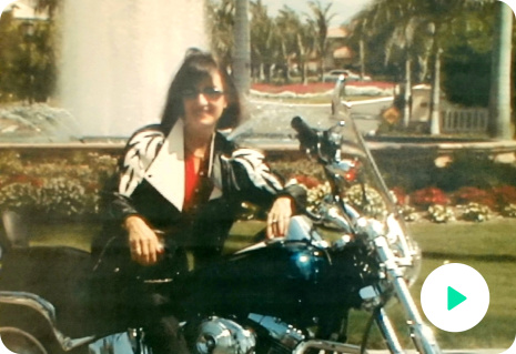 Image of Peggy Sealfon, owner of Supercharge Your Life. It is an older picture of her on a motorcycle.