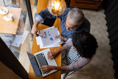 Two people working together at a desk