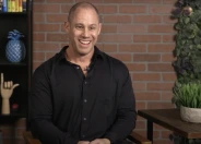 Steve Cook smiling sitting down