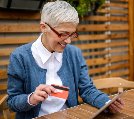 Business owner processing a credit card payment with her Stripe reader.