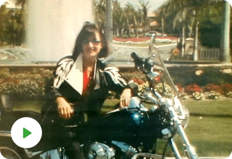 Image of Peggy Sealfon, owner of Supercharge Your Life. It is an older picture of her on a motorcycle.