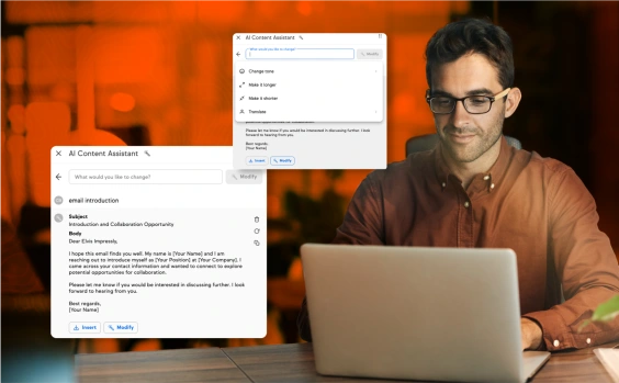 Person using AI Content Assistant on a laptop to draft and modify an email introduction.
