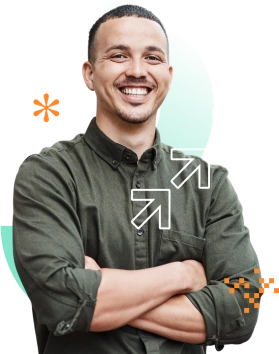 Smiling man standing with his arms crossed