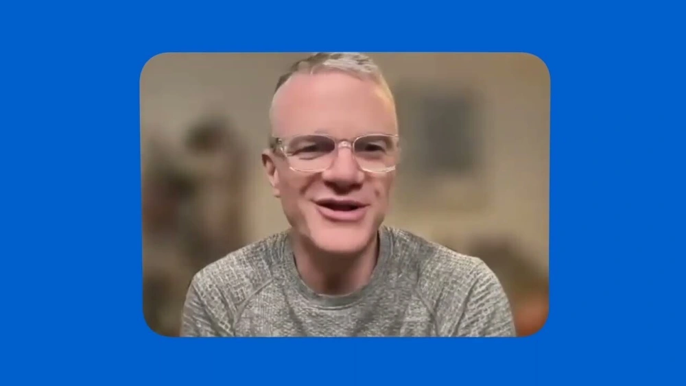 Man smiling on webcam