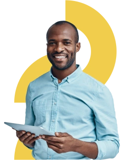 Man smiling holding a tablet