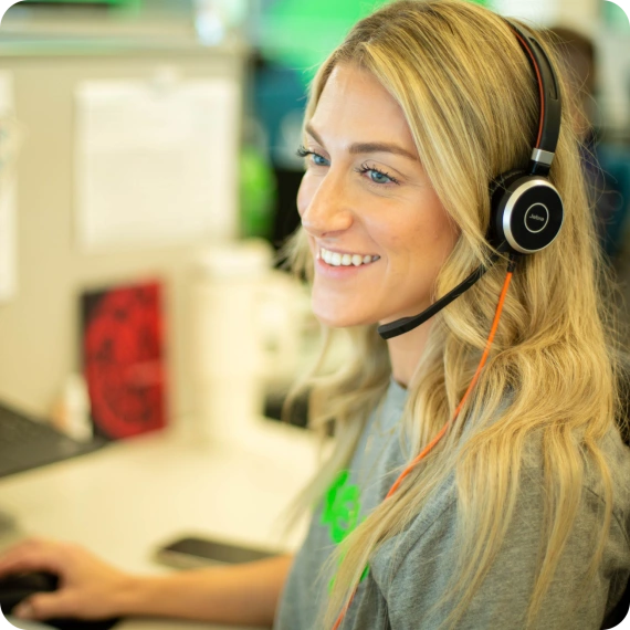 with Keap support team woman smiling with headset on
