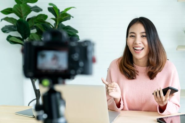 Young woman revording live video