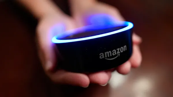Amazon echo dot in person's hands