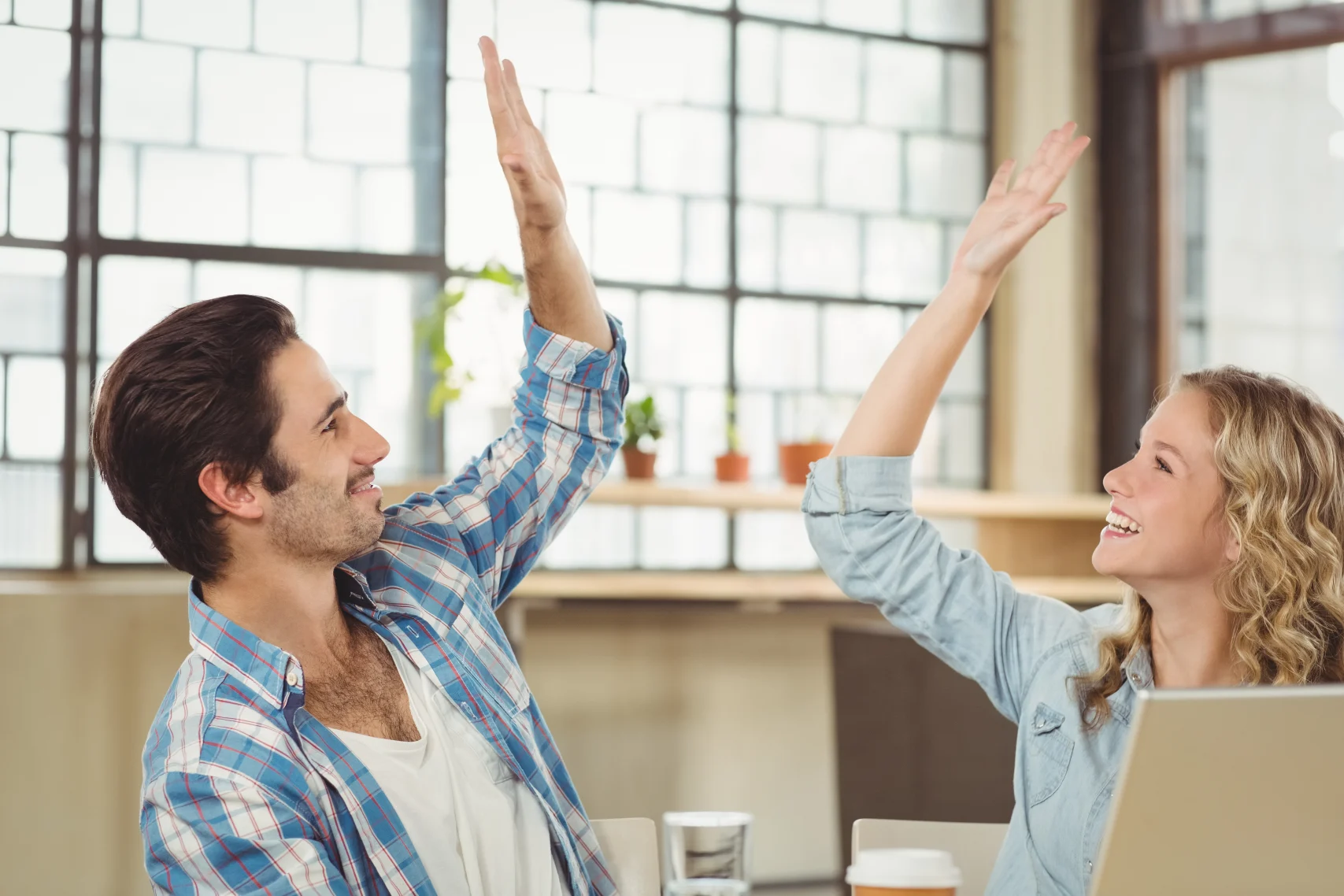 Colleagues giving high five