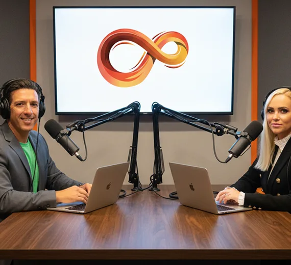 Cre8tive entrepreneurs recording a podcast interview with microphones and laptops in a studio.