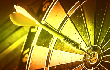 Target marketing or target arrow concept: Bullseye is a target of business. Dart is an opportunity and Dartboard is the target and goal.
