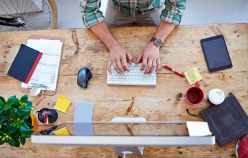 typing on keyboard at desk