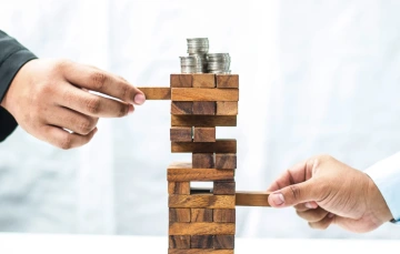 Coins on Jenga tower