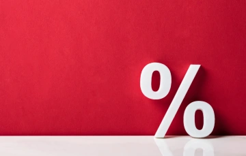 white % sign on red background