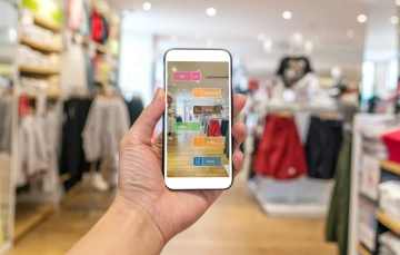 cell phone with augmented reality image in clothing shop