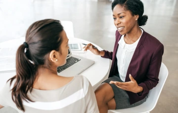 Business owner and client engaging in a conversation