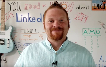 AJ Wilcox in front of whiteboard