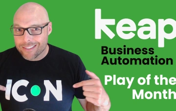 Keap's Brett Fairbourn smiling pointing at his shirt