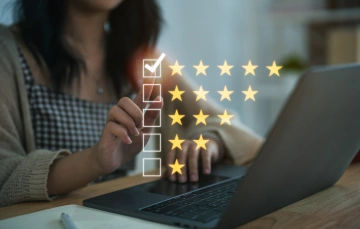 Illustration of a woman selecting 5 stars for her online review