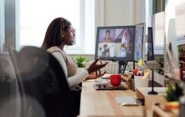 A  business professional using Zoom for video conferencing.