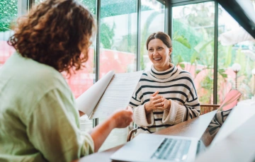 A woman smiling while going through her onboarding process