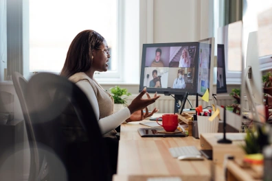 A  business professional using Zoom for video conferencing.