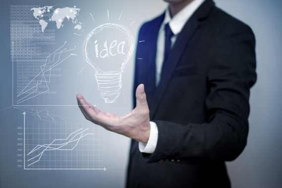 entrepreneur holding an idea lightbulb with graphs