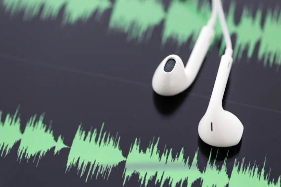 earbuds and sound frequency waves small business success podcast