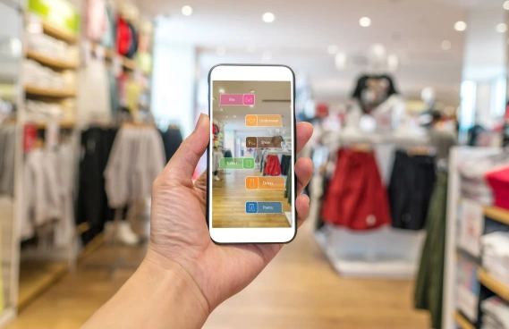 cell phone with augmented reality image in clothing shop