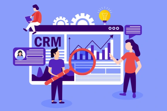 Three people looking at a picture of a CRM dashboard