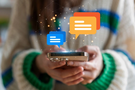 Woman holding smart phone with message graphics