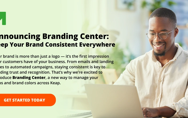 Man smiling as he works on a laptop, next to text reading ‘Announcing Branding Center: Keep Your Brand Consistent Everywhere’